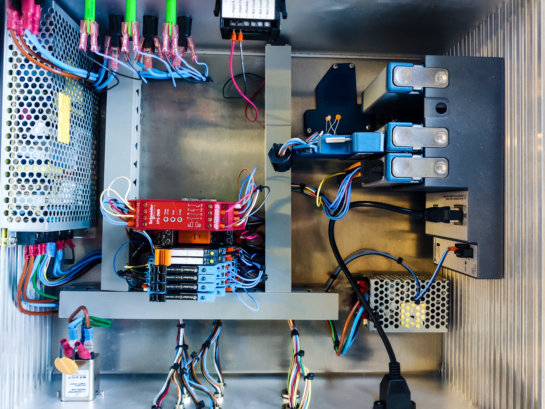 Electrical control components and wiring inside a test bench cabinet